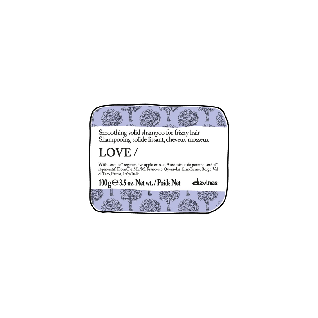 Love Smoothing Solid Shampoo Bar i en miljövänlig fast form, perfekt för att mjuka upp frissigt hår med naturliga och skonsamma ingredienser från Davines.