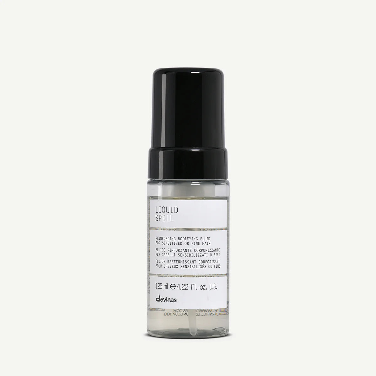 Liquid Spell volymgivande hårstyling i transparent flaska med svart pump, perfekt för känsligt eller tunt hår.