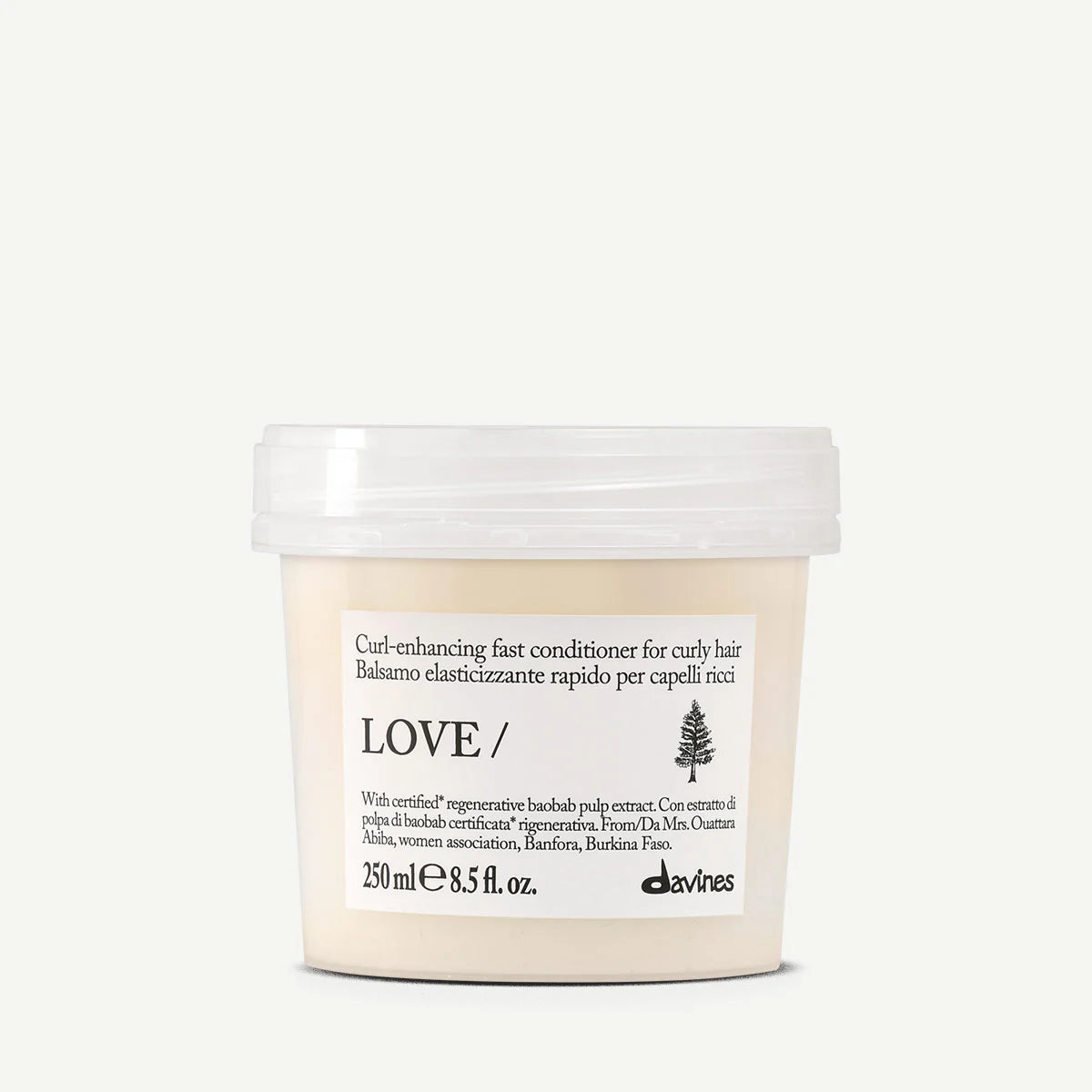 Love Curl Enhancing Fast Conditioner i en miljövänlig förpackning, ett balsam som snabbt framhäver och vårdar lockigt hår med återfuktande egenskaper.