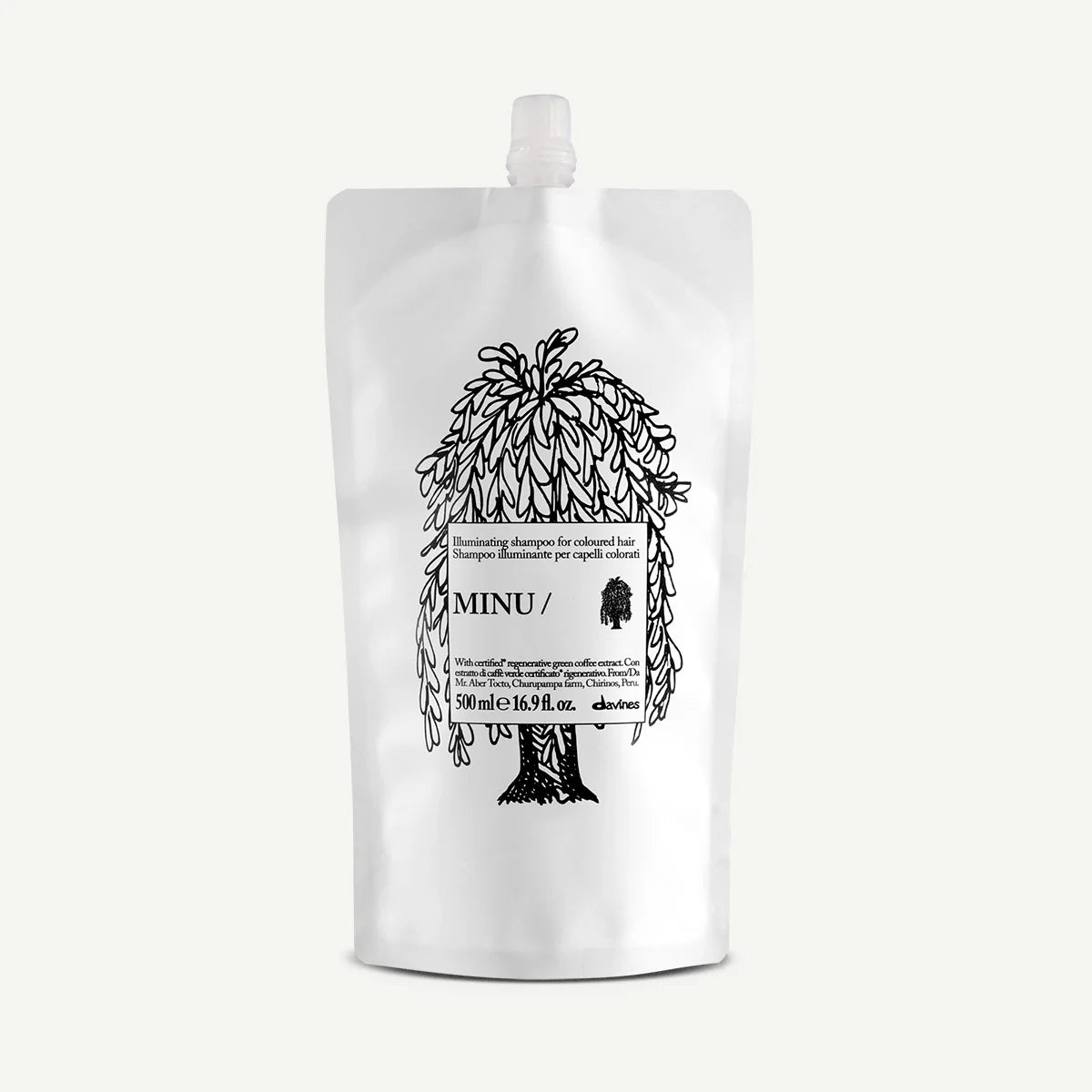 Minu Illuminating Shampoo i en vit påse med svart illustration av ett träd, miljövänligt schampo för färgat hår från Davines.