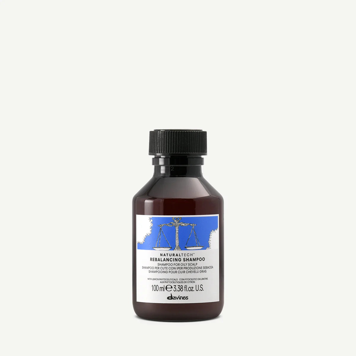 Flaska med Naturaltech Rebalancing Shampoo på 100 ml, en miljövänlig hårvårdsprodukt som balanserar och rengör hårbotten skonsamt.